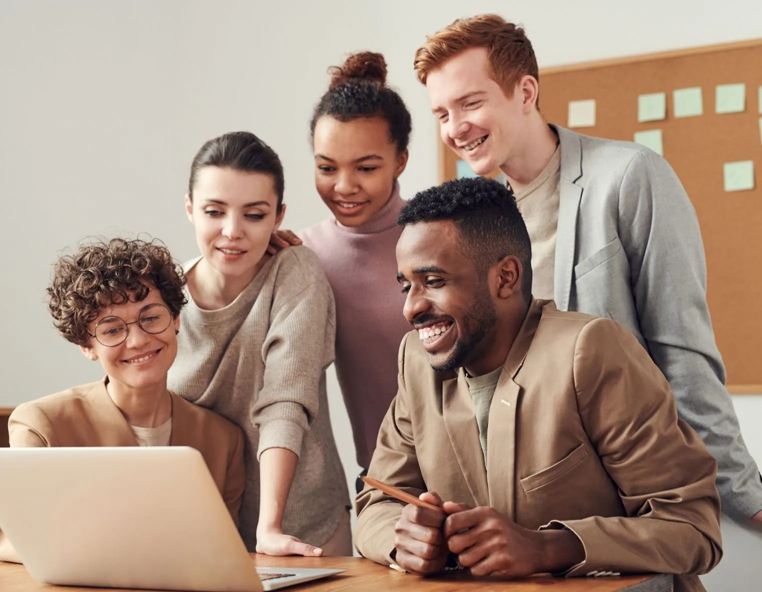 TheAmpify team reviewing ad campaign results on a laptop